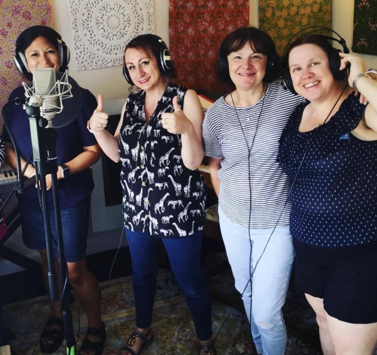 A group of More Harmony members in a recording studio